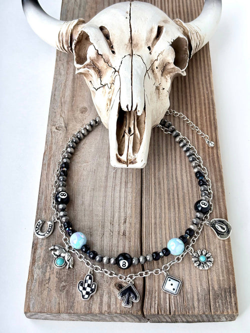 Turqoise stacked charm necklace, featuring a 8 ball, horse shoe, cowboy hat, dice, and more!